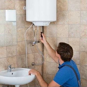 Plumber fixing a water heater